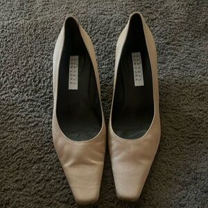 Barney’s tan silk like heel